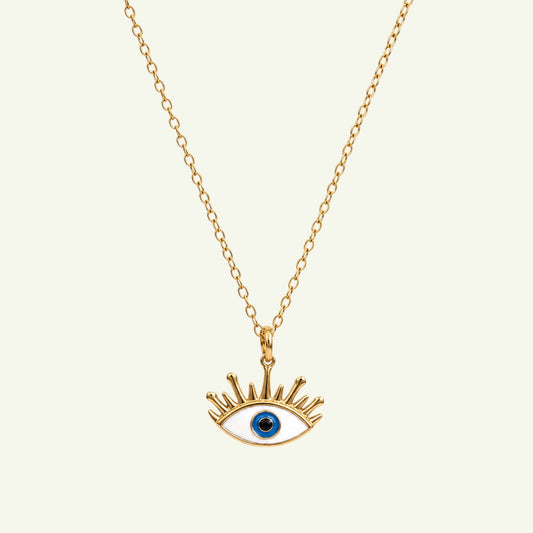 Anzora Jewel Radiant Aegis necklace featuring a gold evil eye pendant with white, blue, and black enamel details.