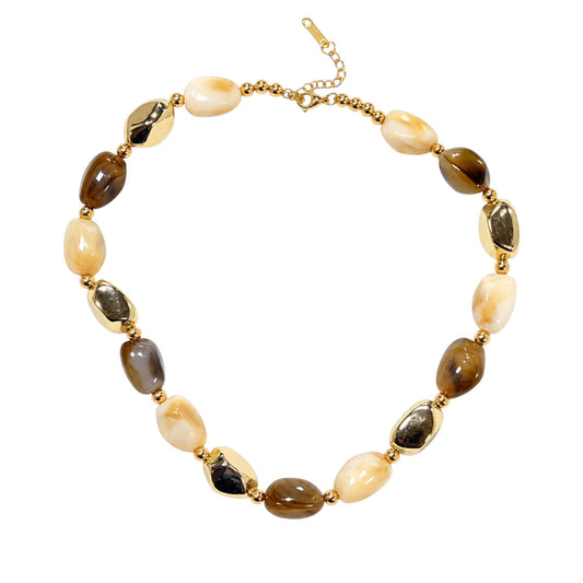 Anzora Jewel Amber & Alloy necklace featuring amber-brown beads, creamy stones, and polished gold-tone accents.