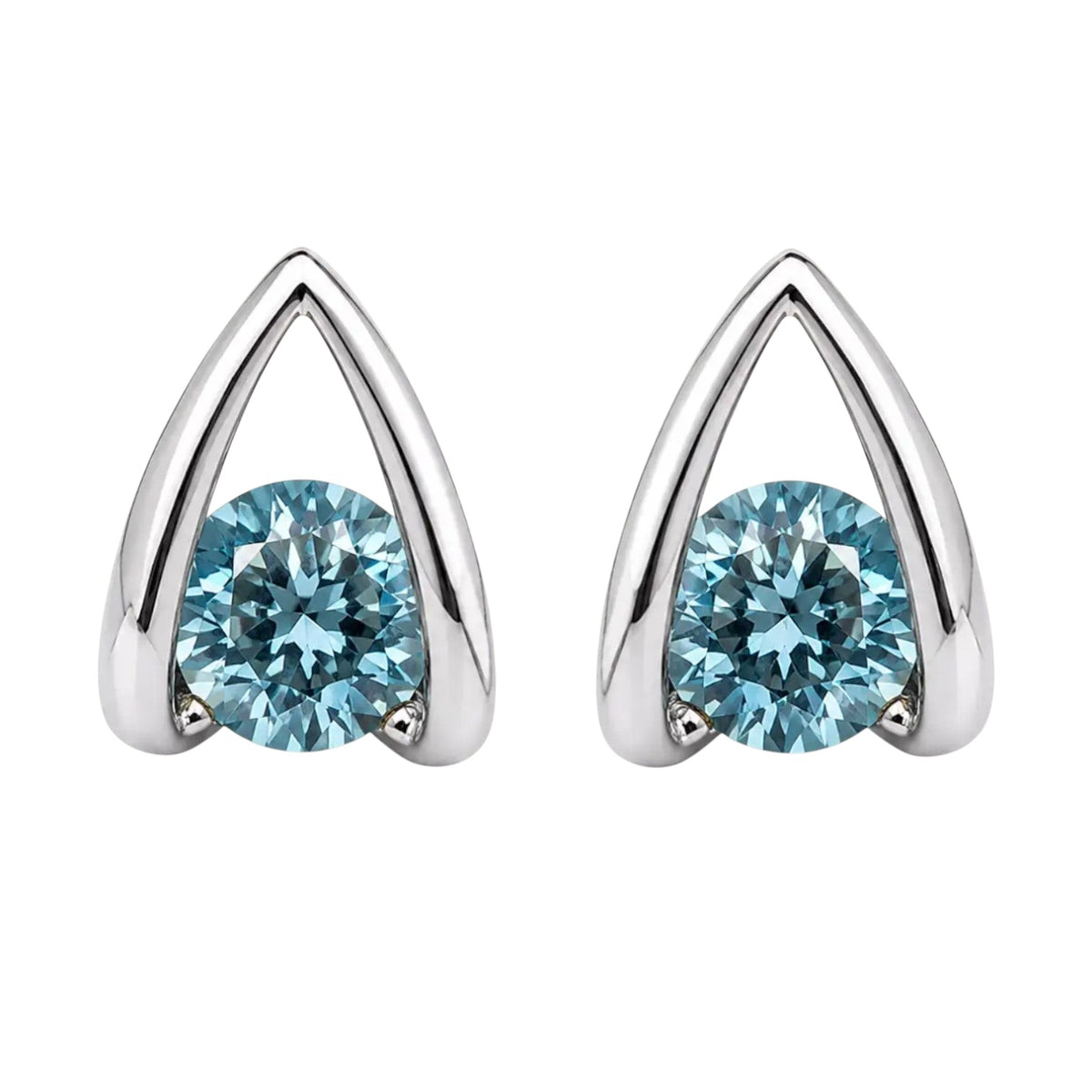 Anzora Jewel Astra Blue stud earrings featuring round-cut ocean-blue stones in a polished architectural silver frame.