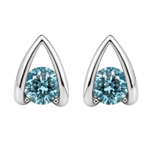 Anzora Jewel Astra Blue stud earrings featuring round-cut ocean-blue stones in a polished architectural silver frame.