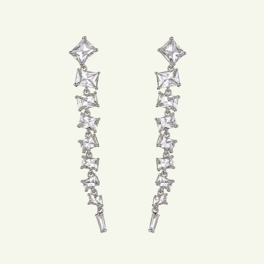 Anzora Jewel Astralis silver drop earrings featuring a cascading line of sparkling baguette and square cut crystals.