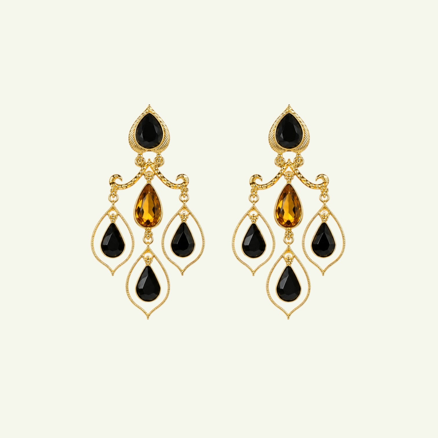 Anzora Jewel Celestia Black drop earrings featuring gold-tone metal, black teardrop stones, and amber crystal accents.