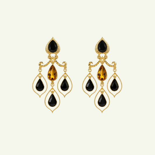 Anzora Jewel Celestia Black drop earrings featuring gold-tone metal, black teardrop stones, and amber crystal accents.