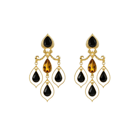 Anzora Jewel Celestia Black drop earrings featuring gold-tone metal, black teardrop stones, and amber crystal accents.