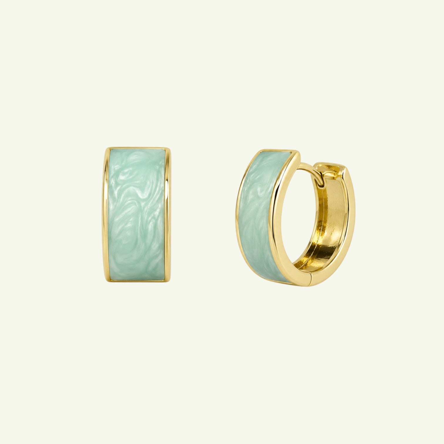 Anzora Jewel Cosmea huggie earrings featuring marbled mint green enamel inlay set in polished gold-tone metal.