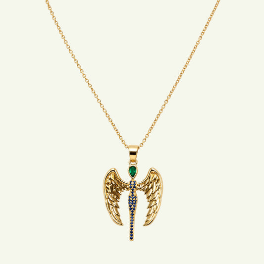 Anzora Jewel Dragon Angel necklace featuring gold wings, a teardrop emerald stone, and blue sapphire accents.