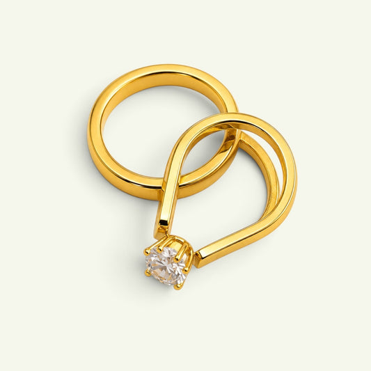 Anzora Jewel Dual Grace Ring featuring a gold-toned open-band design with a brilliant round-cut clear stone.