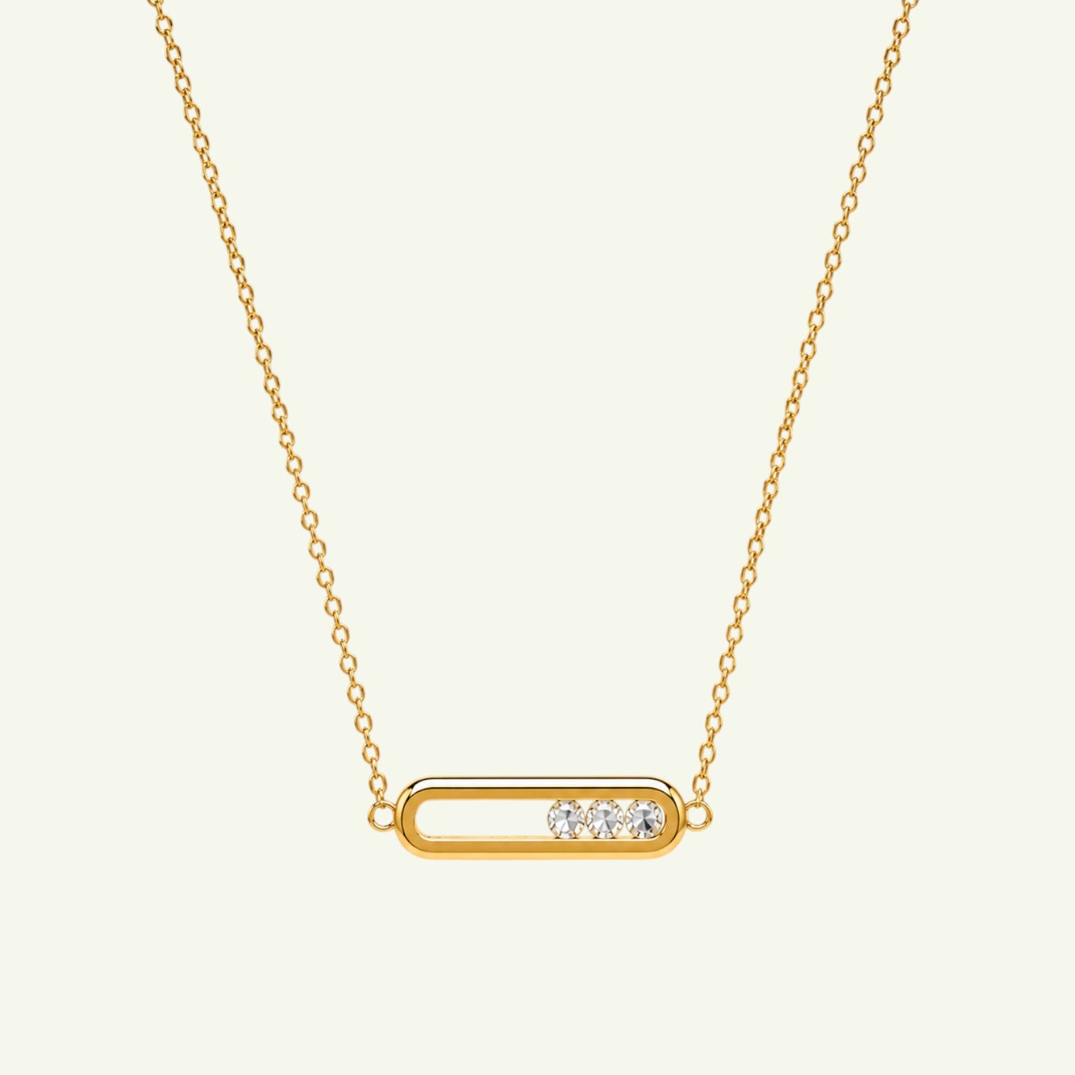 Anzora Jewel gold-toned bar necklace featuring three movable sparkling stones inside an elongated pendant