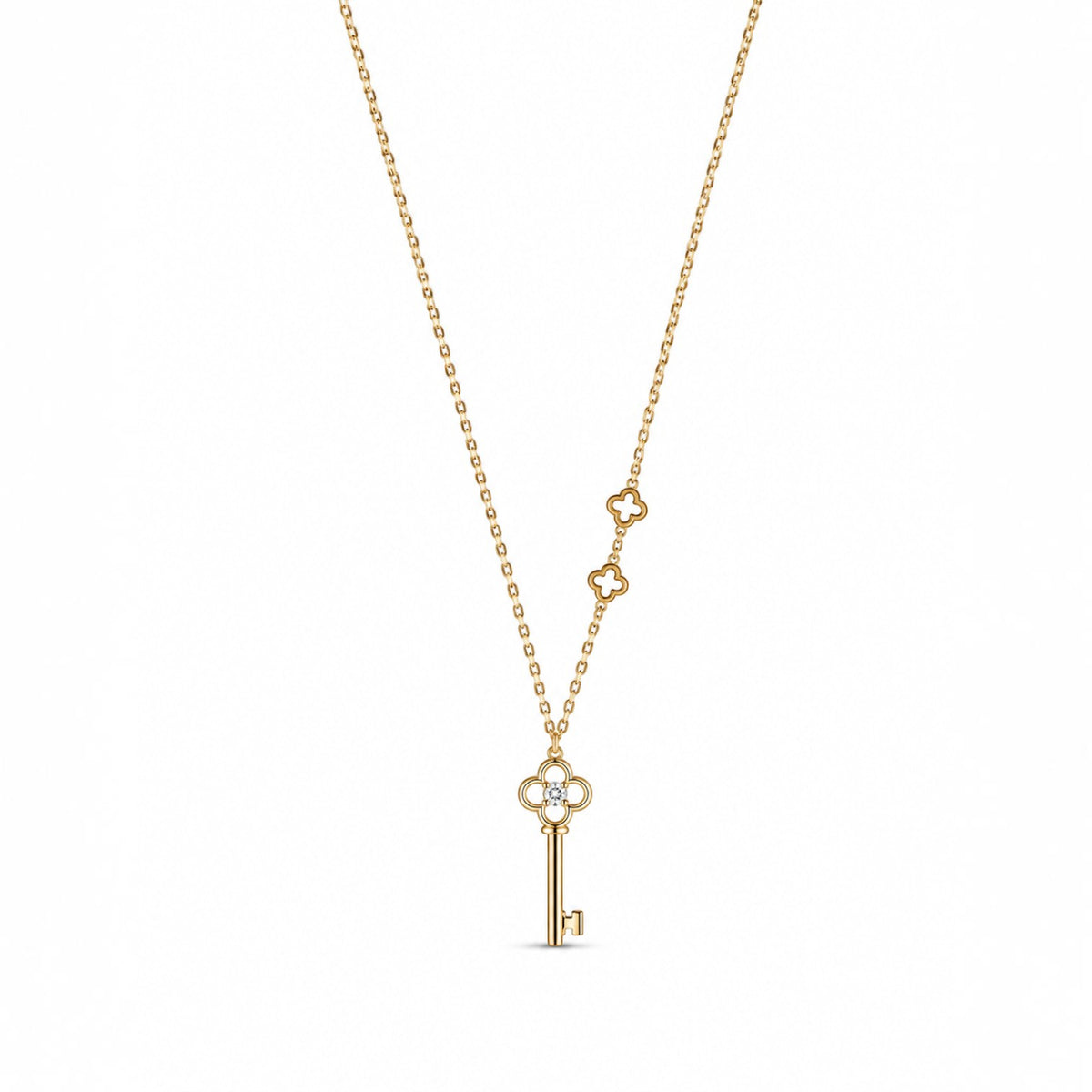 Anzora Jewel Keylisse Delicate gold necklace featuring a key pendant with a sparkling stone and floral accents.