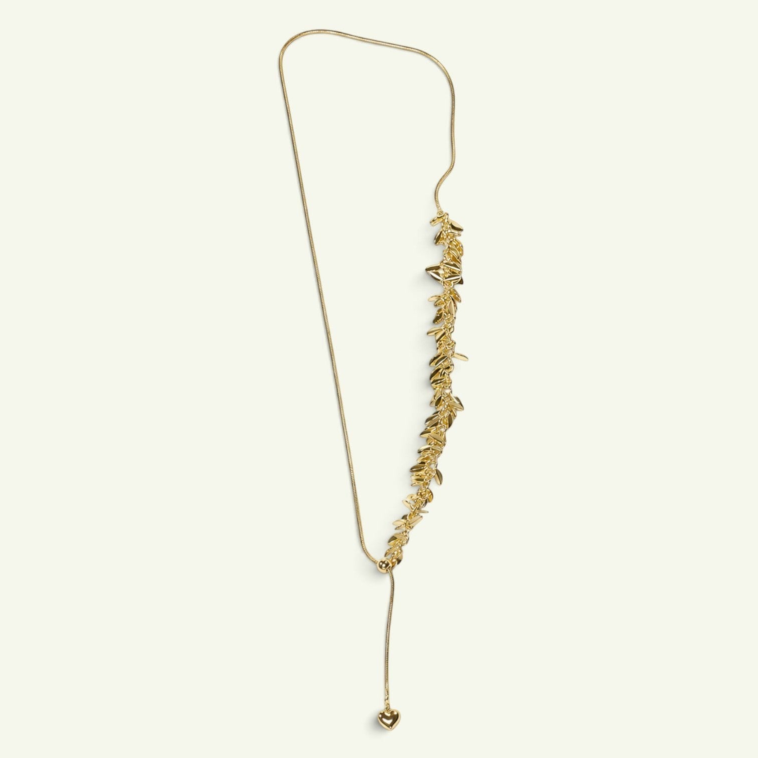 Anzora Jewel gold-toned adjustable necklace featuring a cascading leaf motif and a small heart-shaped charm.