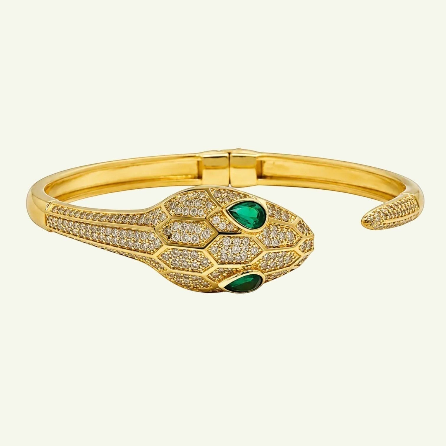Anzora Jewel gold-tone hinged serpent bracelet with pavé crystals and emerald-green drop eyes.