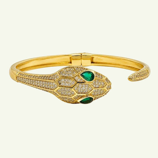 Anzora Jewel gold-tone hinged serpent bracelet with pavé crystals and emerald-green drop eyes.