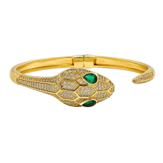 Anzora Jewel gold-tone hinged viper bracelet with pave crystals and emerald-green drop eyes on a serpent head design.