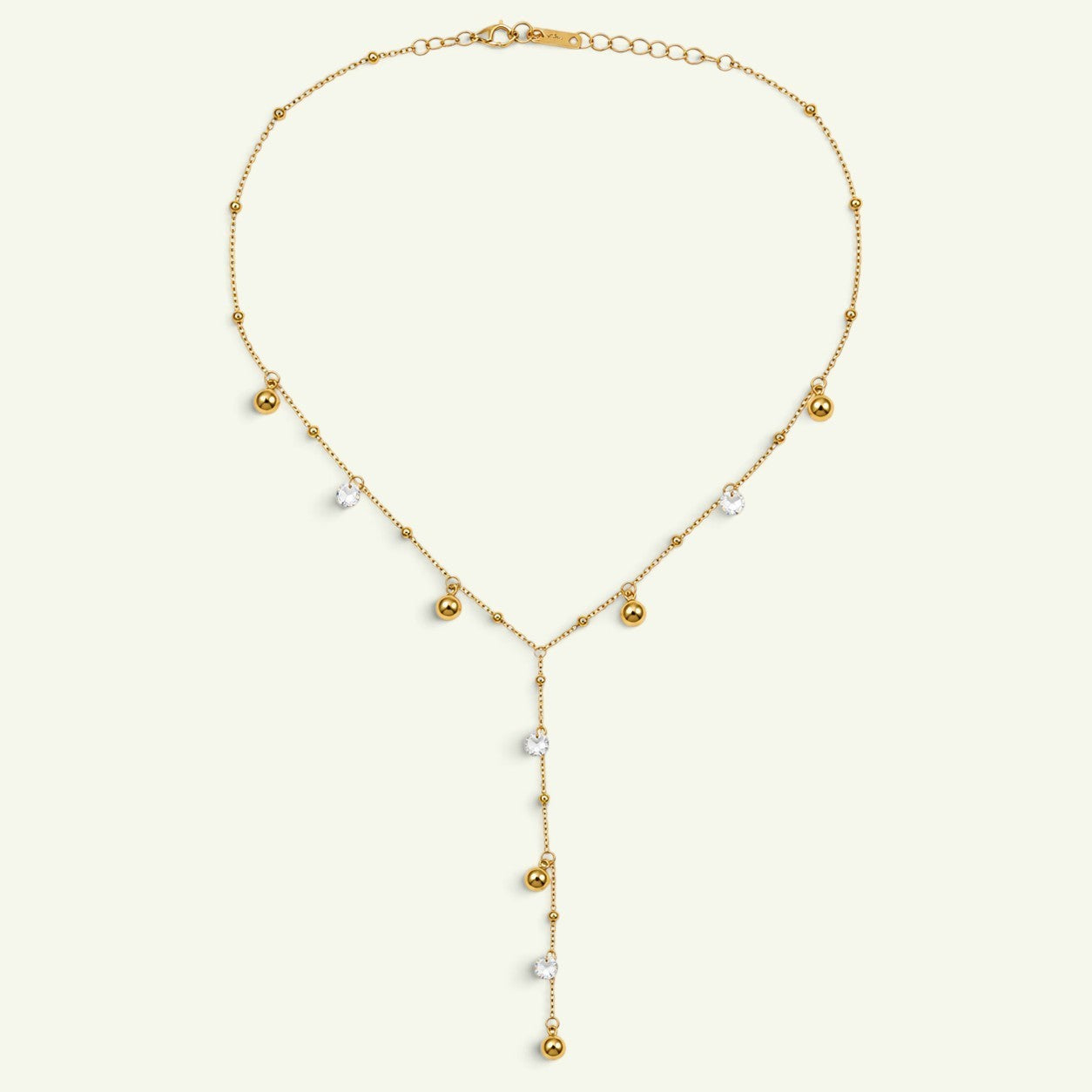 Anzora Jewel gold-toned Y necklace with polished spheres and sparkling clear stones on a delicate chain.