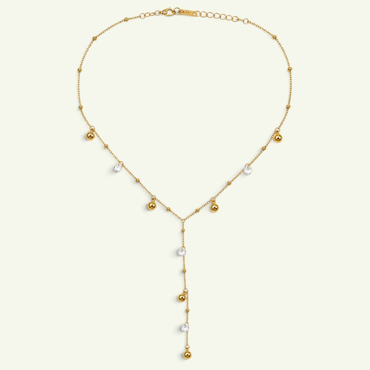 Anzora Jewel gold-toned Y necklace with polished spheres and sparkling clear stones on a delicate chain.