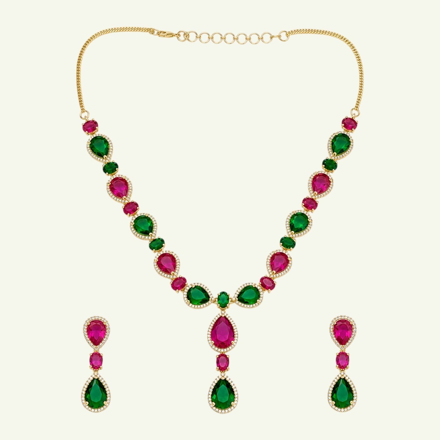 Anzora Jewel Mirach necklace and earring set with pear-cut ruby-red and emerald-green stones in gold-tone halo settings.