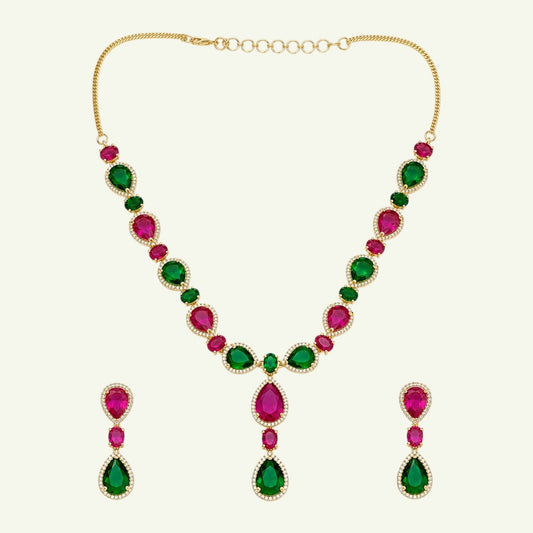 Anzora Jewel Mirach necklace and earring set with pear-cut ruby-red and emerald-green stones in gold-tone halo settings.