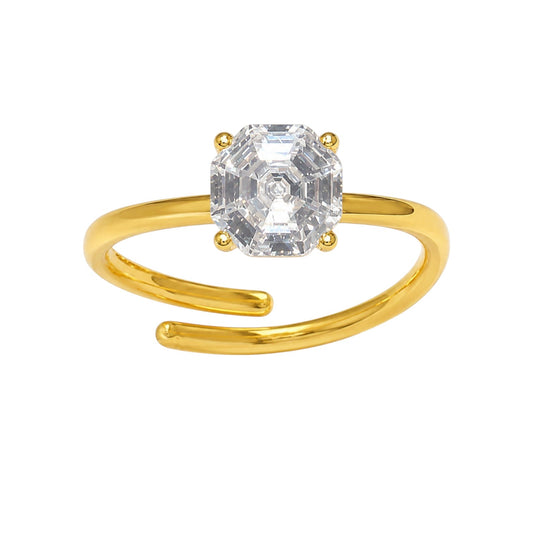 Anzora Jewel Octavia solitaire ring featuring an octagonal-cut clear stone on a polished gold-tone open-ended band.