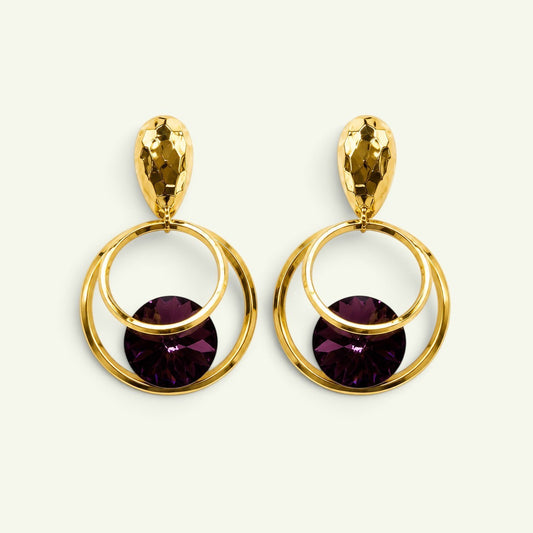 Anzora Jewel Orbit statement earrings featuring hammered gold studs, nested gold hoops, and deep purple crystals.