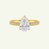 Anzora Jewel Aurelle ring featuring a pear-shaped brilliant-cut stone set in polished gold with a diamond-set band.