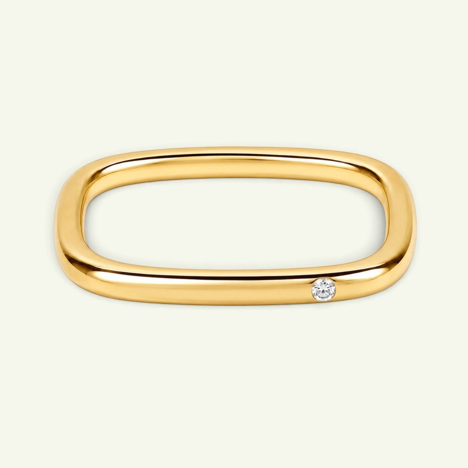 Anzora Jewel Quadra diamond ring featuring a polished gold-tone square band with a single brilliant-cut diamond.