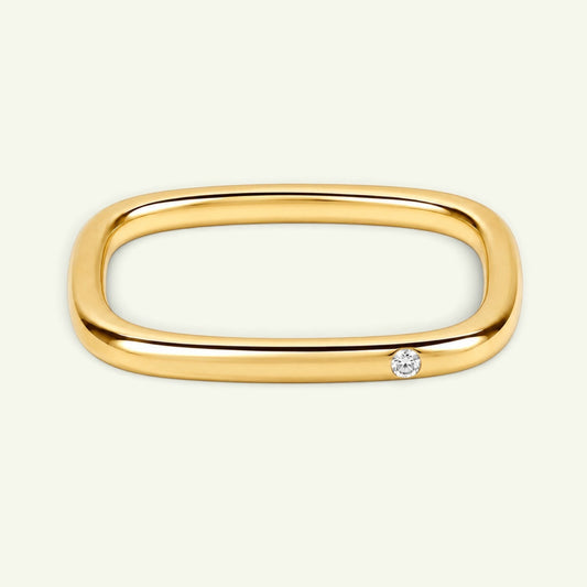 Anzora Jewel Quadra diamond ring featuring a polished gold-tone square band with a single brilliant-cut diamond.