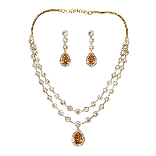 Anzora Jewel Solis Gold necklace set with layered American Diamond chains and golden teardrop stone pendants.