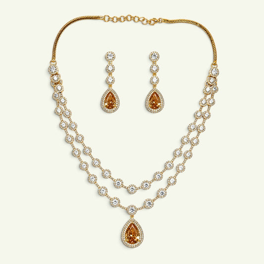 Anzora Jewel Solis Gold necklace set with layered American Diamond chains and golden teardrop stone pendants