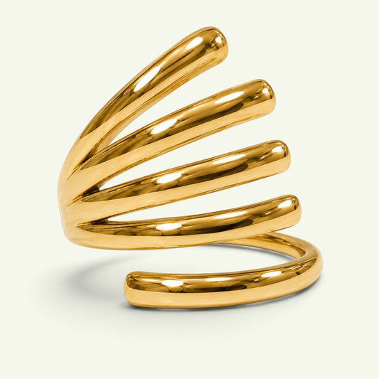 Anzora Jewel Vortex Coil Ring featuring a polished gold-tone finish with a sculptural, spiraling multi-band design.